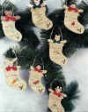 Christmas seed packets.  Pattern includes 6 " rabbit, cow, pig, boy, girl, bear and cat in easy to paint Christmas stocking seed packets.