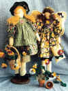Pansy.  Pattern includes 2 different 22" dolls with yo yo flowers.