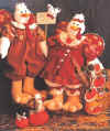 Horace & Hedda Gobbler.  Pattern includes 18" boy and girl turkey, 6" baby, pumpkins and cow sign. Wings are woven strips of fabric in the shape of a heart.